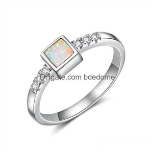 Klaster Pierścienie Prawdziwe 925 Sterling Sier White Fire Opal Clear Zirconia Crystal zaręczynowe obrączki Women S925 Prezenty biżuterii 3757 Dr Dhqpt