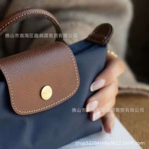 Borsa di design di lusso Handags Mini Jiaozi Longxiang 2024 Nuova moda manico singolo in nylon con mini borsa a tracolla non perforata in vera pelle