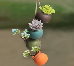 Fourpiece Set of Hanging Flowerpot Ceramic Airpermeable Balcony Wallmounted Plant Pot Hanging Rustic Pastel Ceramic Planter Y28215194