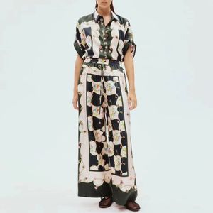 Australian designer Black and white silk floral print lapel short sleeved shirt and pants two-piece set