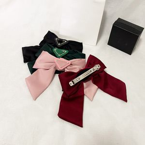 Designer de luxo mulheres invertidas letra triângulo grampo de cabelo moda bowknot barrettes clássico menina jóias de cabelo de aço inoxidável cocar vintage acessório de cabelo