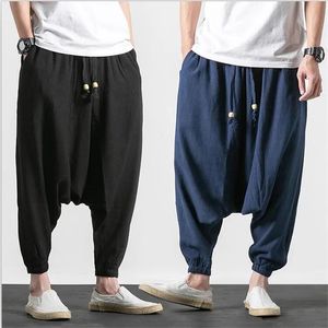 Pantaloni nuovi pantaloni da ballo larghi da uomo in stile giapponese pantaloni Harem in lino di cotone pantaloni incrociati con coulisse puro taglie forti M7XL