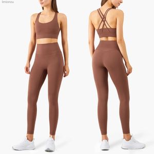 Aktywne zestawy Kobiety Zestaw jogi 2 -częściowe ubrania treningowe dla kobiet Cross Back Crop Top Sports Bra Fitness Top Gym Leggings Yoga SportSearl240118