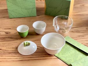 Designer Green Travel Tea Set Bekväm Portable Zongzi Tea Set Green Bamboo Leaf Presentförpackning med handväska Tea Making Set