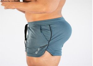 Pantaloncini da allenamento per palestra da uomo Uomo Abbigliamento sportivo casual Allenamento fitness Pantaloncini da corsa a griglia ad asciugatura rapida Atletica leggera2646906