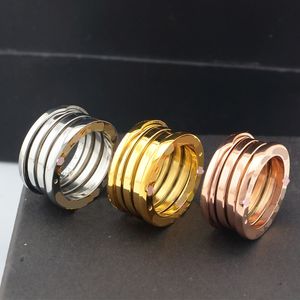 Luksusowy projektant 18K Gold Spring Pierścień ze stali nierdzewnej Srebrny Różowe Złotą Pierścień mody dla miłośników Biała czarna ceramiczna pary Pierścień dla kobiet Prezent biżuterii