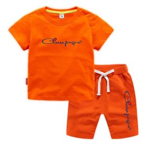 Abiti estivi 0-13 anni Ragazzi Ragazze Lettera di marca Stampata 100% cotone T-shirt arancioni Pantaloncini sportivi Set da 2 pezzi Set di tute casual comfort per bambini