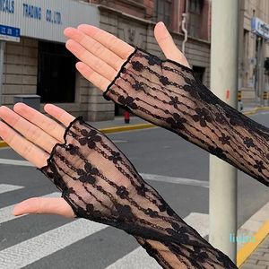 Mode spetsar ihåliga fingerlösa handskar kvinnor tunna mesh arm ärmar sommarsol skydd blomma virkning långa spetsar handskar