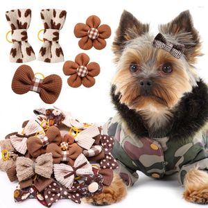 Cão vestuário 10 pçs inverno arcos filhote de cachorro gato flor bowknot faixas de borracha para cães moda pet cabelo decorar acessórios de aliciamento