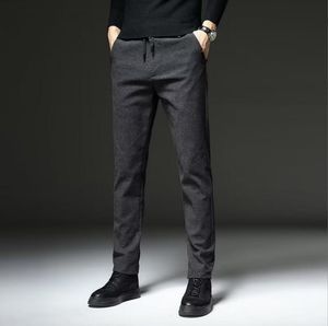 Pantaloni casual da uomo in tessuto spazzolato autunno inverno Pantaloni da lavoro da uomo spessi in cotone sottile Pantaloni grigi neri Uomo Taglie forti 38