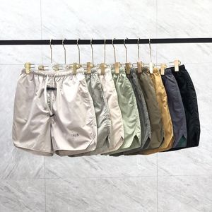 Pantaloncini da spiaggia casual estivi da uomo di tendenza alla moda, firmati da uomo, corti, sportivi, in nylon, al ginocchio, pantaloni ESSENTI