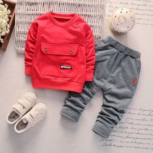 Zestawy odzieży 2pcs Zestaw dziecka z długim rękawem Baby Solid Duża kieszonkowa moda pionowa