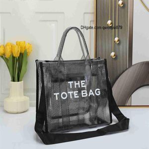 Designer Totes Clear PVC PVC grande marca a bolsa de bolsas de designer de malha de malha de ombro transparente Mulheres geléia de mão casual praia sh256o