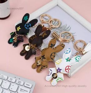 desigenr biżuteria projektant Klucz Klucz Rings Pu Skórzane klęsce torebka torebka wisiorek łańcuch kluczyek urok Brown Flower Mini Bag Prezent dla mężczyzn kobiety