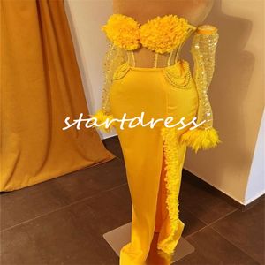 スリットのあるユニークな黄色のウエディングドレス2024豪華なスパンコールの長袖の羽毛イブニングドレス恋人のフリルスルーブラックガールズスペシャルイラインパーティーパーティーガウンを見る