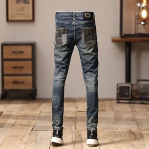 Jeans da uomo con cuciture design personalizzato elasticizzato dritto stile americano tendenza pantaloni da moto attillati con toppe strappate irregolari