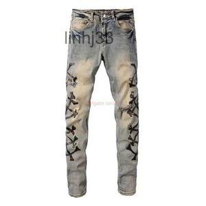Мужские джинсы Дизайнерская одежда Джинсовые брюки Amires Amies High Street Камуфляжная кость с кожаными отверстиями, вырезанными ножом, вымытыми в старый Me1T6M