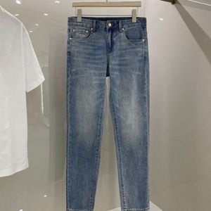 jeans da uomo di alta qualità firmati Jeans uomo donna moda azzurro triangolo di metallo lettere stampate pantaloni grafici casual larghi pantaloni slim stretch a gamba piccola