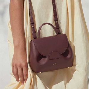Sälj fransk designerpåse Pole axel crossbody väskor kvinnor läder handväska pendling smiley ansikte tygväska bärbar ryggsäck väska 231015