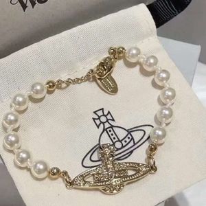 Charm Nail Armband Designer Armband Viviennr Westwood Jewelry for Woman Empress Dowager full av diamanter Saturn Pearl Armband Kvinna Samma stil versatil