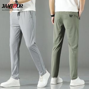 Pantaloni Primavera Estate Nuovi Pantaloni Casual Uomo Tasca con cerniera Jogging Slim Fit Chino Pantaloni moda Maschile Marchio di abbigliamento Pantaloni taglie forti 38