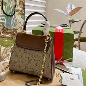 Handtasche mit goldglänzender dekorativer Metallkette, Canvas-Patchwork-Lederbesatz, modischer Reise-Business-Damenstil
