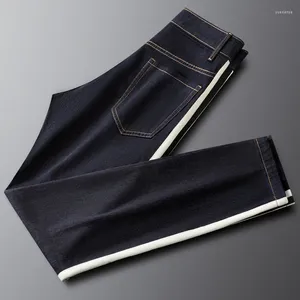 Męskie spodnie 2024 Wiosna/lato przystojny czarno -biały w paski dżins