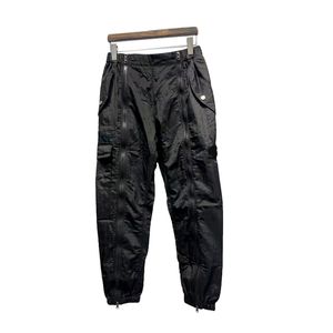 Męskie spodnie designerskie spodnie Topstoney Spodnie Metalowa nylonowa odznaka kieszeni swobodne spodnie cienkie spodnie odblaskowe Spodnie luźne stopy