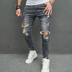 Zagnione chude mężczyźni Pencil Dżinsy Stylowe męskie hip -hopowe plamek atrament drukowane otwory w trudne spodnie dżinsowe dla mężczyzn 240227