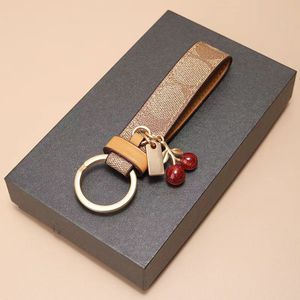 Designer cherry keychain car keychain European and American fashionable womens car key pendant creative high-end bag pendant