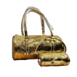 Bolsa tote cilíndrica pequena de couro brilhante prateado dourado designer