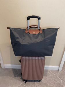 Duffle Bag designer handväska, designerväska, läder hög kapacitet resväska, kohud pendling bärbar bagageväska, boardingväska, fitnessväska, utomhussportväska
