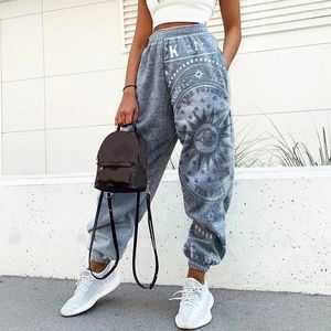 Kvinnors byxor 2024 vintage streetwear plus storlek kläder för kvinnor hiphop pant ficka kvinnor löst tryckta joggarbyxor