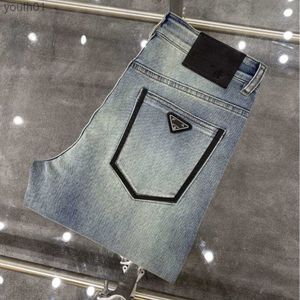 Dżinsy damskie Wysoka jakość dżinsów Designer Pants Men Slim Małe, proste bawełniane swobodne spodnie dżinsowe modzie trójkąt list graficzny dżinsowe spodnie 240304