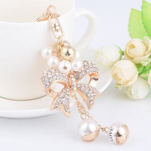 Ny Fashion Ins Luxury Designer Diamond Rhinestone Cute Bow Pearl Bag Charms Tassel Keychains White Gold223T