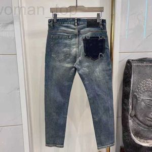 Jeans masculinos designer jeans masculinos impressos adesivos carta personalizada vintage lavagem solta estiramento reto resistente ao desgaste top row patch calças casuais 4ooy