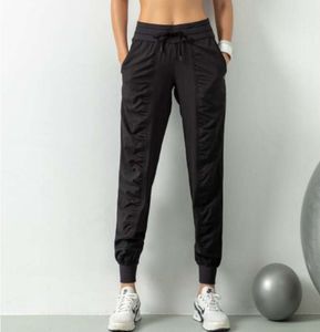 Ll andningsbara sportbyxor Gymkläder kvinnors joggar snabb torr smal löpning träning fitness leggings nio poäng ficka casual byxor lululemens 1102ess