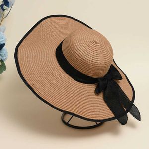 Wide Brim Hats Bucket Hats New Summer Womens Rowing Beach Hat Womens Casual Panama Hat Womens Classic Flat Bow Knot Straw Hat Womens Gift J240305