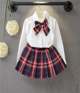 Perakende Kids Designer Trailtsuits Girls Bow gömlek ekose etekler 2 adet kıyafetler Korean moda uzun kollu takım elbise set çocukları bezin3733842