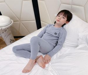 Outono crianças conjuntos de pijamas de cor sólida crianças meninas meninos algodão longo slevse camisa calça dormir bebê macio pijamas roupas287v2867342