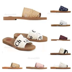 2023 Top Woody Sandals Womens Mules Flat Slides Light Tan Beige White Black Pink Blue Lace Lettering Canvas Slippers Womens Summer utomhus inomhusskor EUR35-42