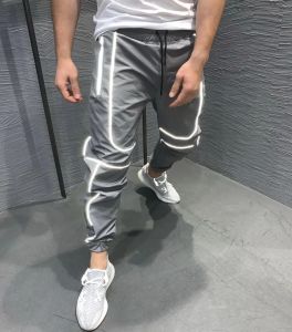 Sweatpants 2023 Nya män reflekterande randjoggare byxor sport snabb torr män vindbrytare ljus tröjor man streetwear hip hop byxor