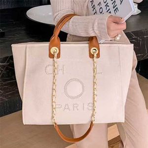 % 70 Fabrika Çıkışı Kapalı Kadınların El Tuval Beach Bag Tote Çanta Klasik Büyük Sırt Çantaları Kapasite Küçük Zincir Paketleri Büyük Crossbody Zo2o Satış