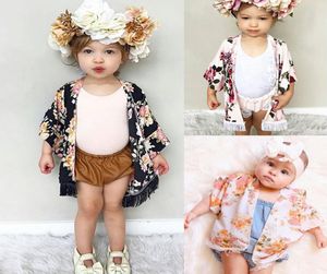 Baby Girls Caps Poncho مع شرابات اللون الأسود الأزهار المطبوعة نصف الأكمام العريضة الربيع الصيفية TOPS TOPS 15T2016106