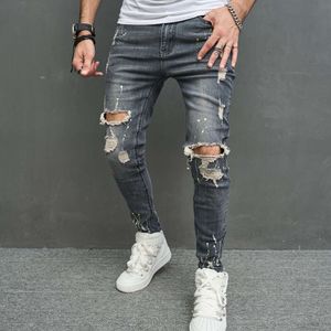 Zerrissene dünne Männer-Bleistift-Jeans-Hosen Stilvolle männliche Hip-Hop-Sprenkel-Tinten-bedruckte Löcher Distressed-Stretch-Denim-Hosen für Männer