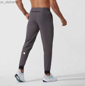 Męskie spodnie Lululemen lulu krótkie spodnie strój jogger sport Szybki suchy sznurka gym kieszenie na spodnie spodnie Męskie elastyczne modne marka 240308