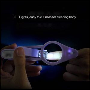 Altre luci Illuminazione Tagliaunghie per bambini con luce a led con lente d'ingrandimento Pinze di sicurezza anti-carne in acciaio inossidabile Consegna a goccia viola Dhclv