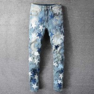 Jeans masculinos Mens Jeans Azul Estrela Buraco Empilhados Costura Pés Motocicleta Calça Patchwork Jean Homens Coreano High Street Moda Gráfico JeansMens 240308