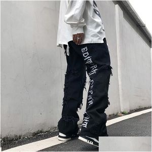 Jeans da uomo strappati Jean Hip Hop Pantaloni da uomo Tendenze Abbigliamento Lettera Y2K Stampa Uomo Streetwear Donna Flare Goth Harajuku Baggy Trendyol D Dhavs