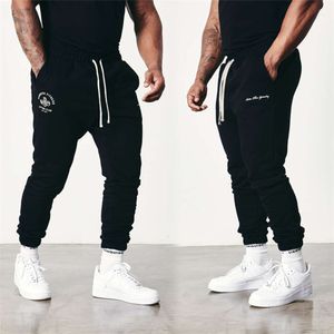 Nya män Sweatpants Joggers Sports Fiess Casual Pants Cotton Mid midja Tryckt raka byxor Gym Running Training Sweatpant